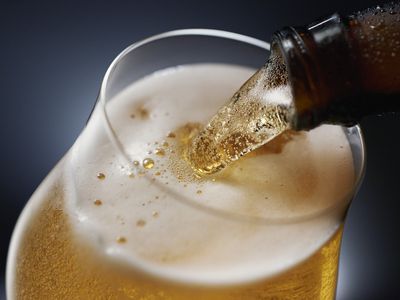Close up of beer being poured into a glass