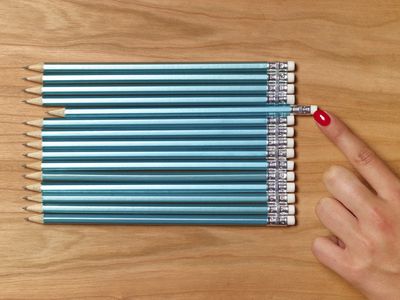 Woman organizing pencils that are all exactly the same