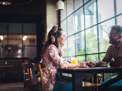 Passionate couple talk at restaurant table