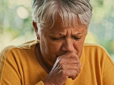 older person coughing