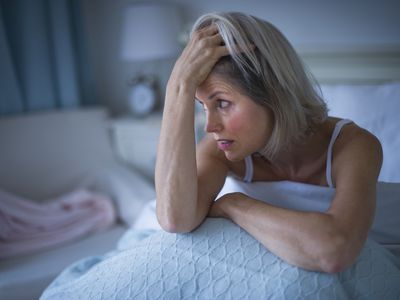 Woman in bed suffering from insomnia