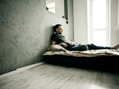 depressed man in bed