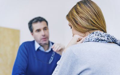 therapist talking to woman