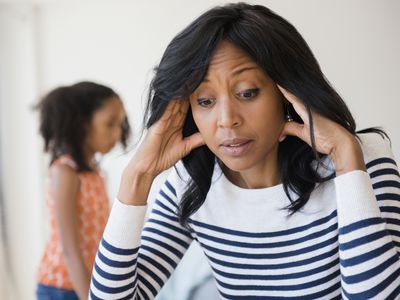 mom frustrated because her child nearby has been misbehaving