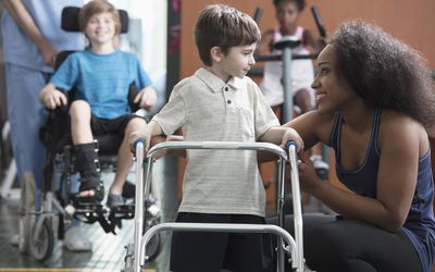 Physical therapists helping children
