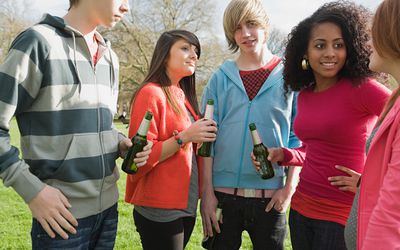 Teenagers in the park with beer