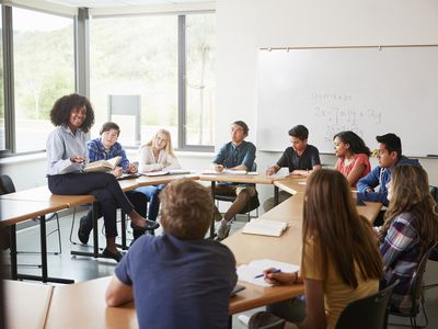 woman teaching a class of students