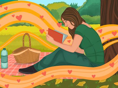 woman reading on a picnic blanket at the park