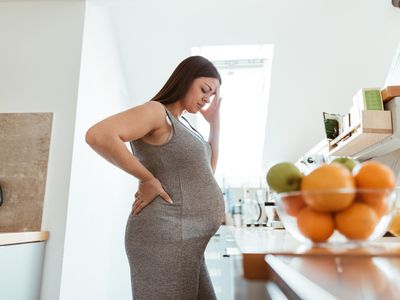 pregnant woman feeling bad at home