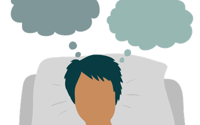 Person in bed having anxious thoughts